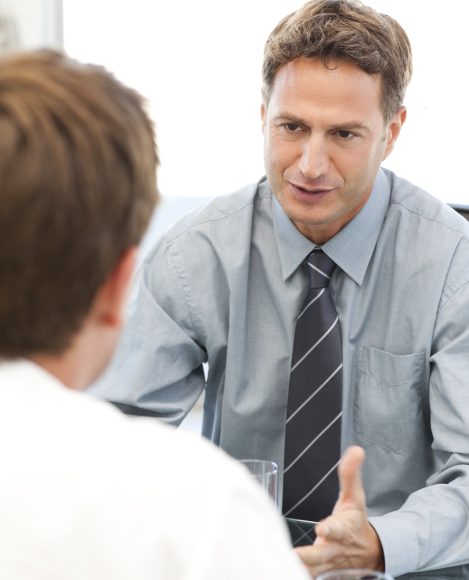 Charismatic manager during a meeting with an employee at the office